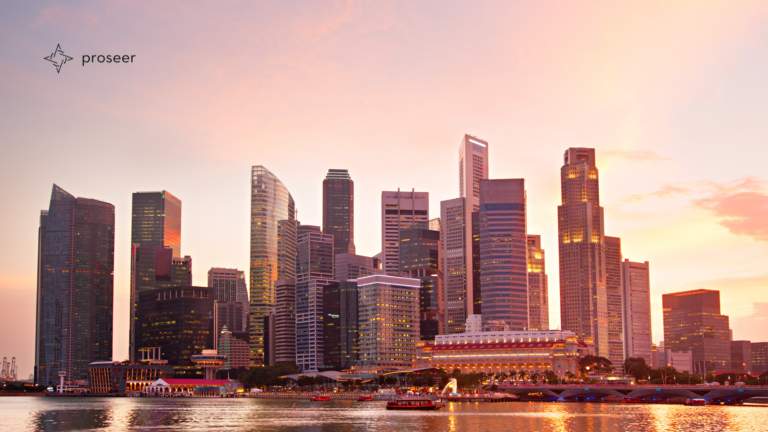 Waterfront city skyline at sunset with the Proseer logo.